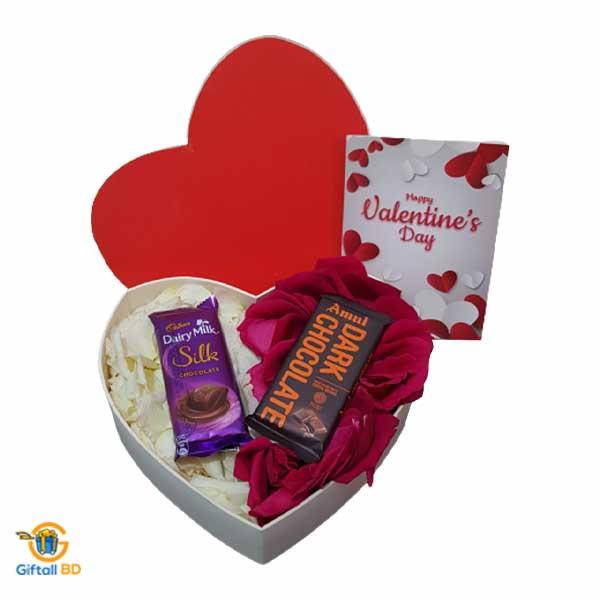 Rose petals with chocolate in a Heart